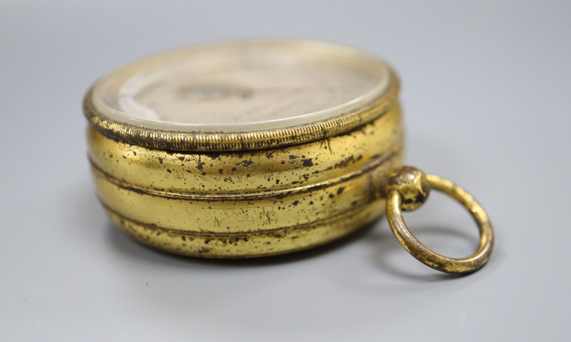 A late 19th century gilt brass compensated barometer, combined thermometer and compass, by Tucker of Bristol and Clifton, 42mm.